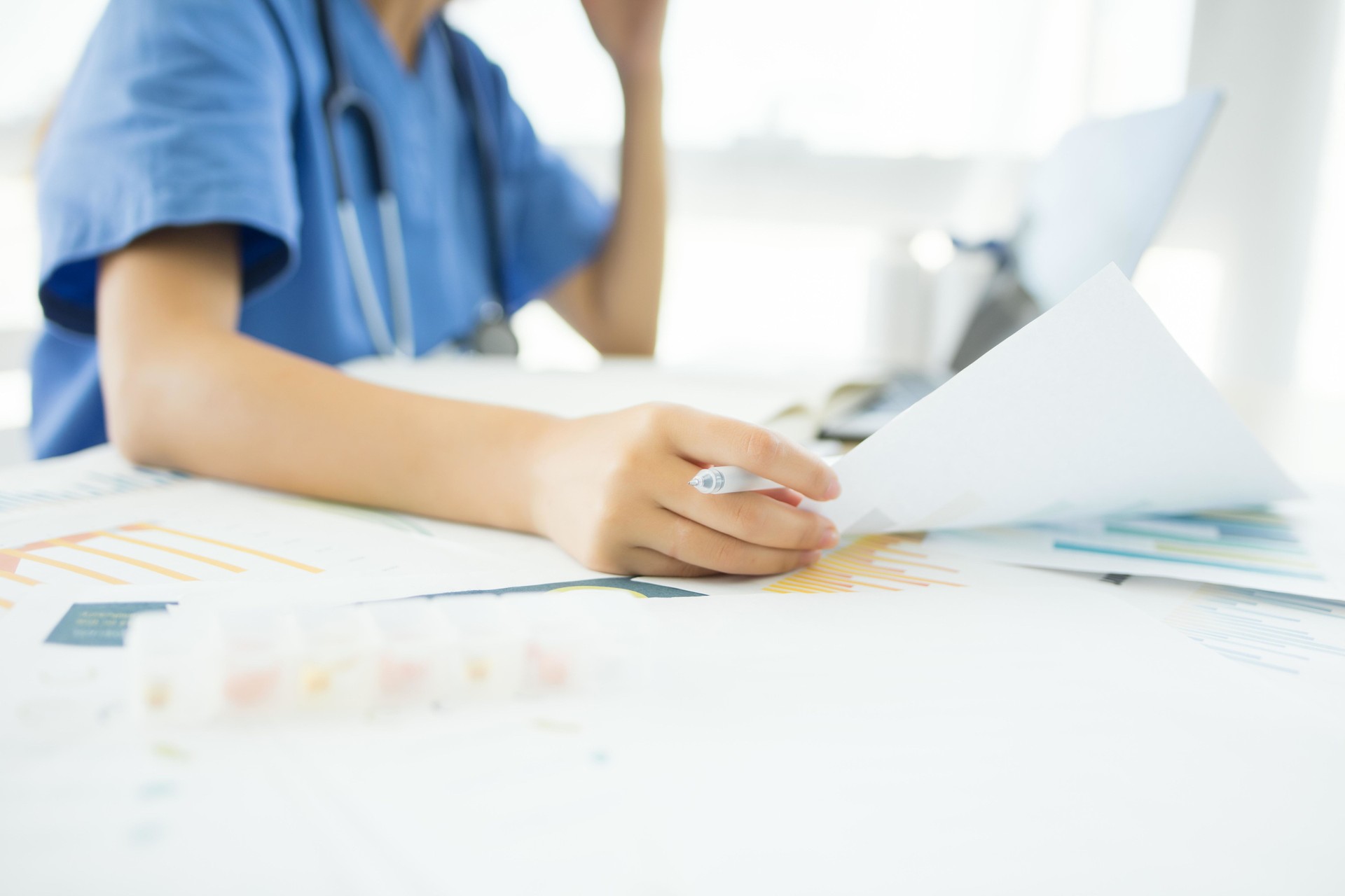 A nurse is reviewing a patient's medical records.