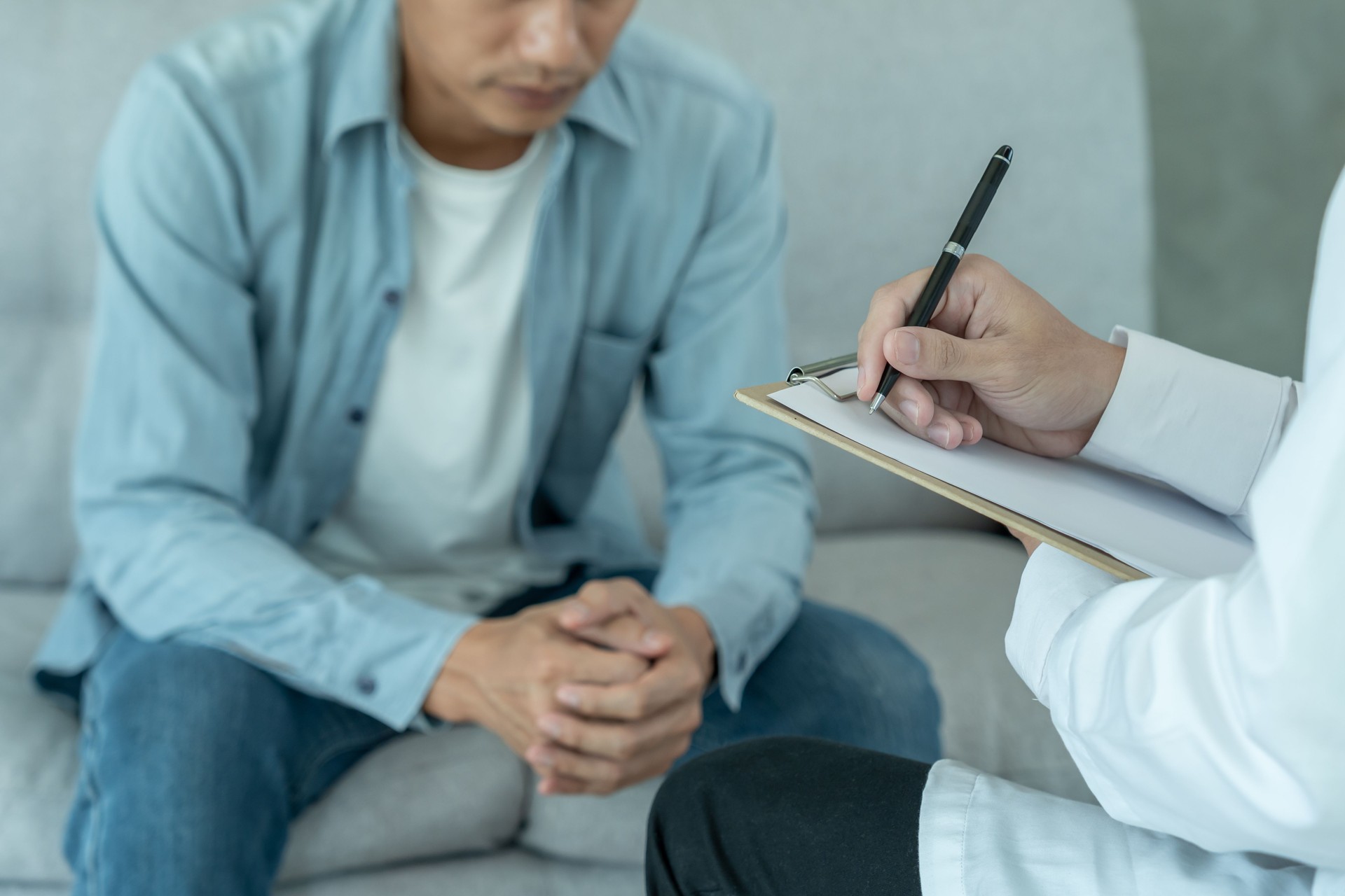 man with mental health problems is consulting. psychiatrist is recording the patient's condition for treatment. encouragement, love and family problem, bipolar , depression patient, protect suicide